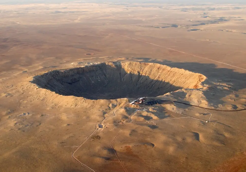 Barringer Meteor Crater in northern Arizona is one of the best preserved meteorite craters on Earth.  It was created about 50,000 years ago by a 50-meter wide nickel-iron meteor.  The speed of the impact is estimated to be 13 to 20 km/sec (29,000 to 45,000 miles/hour) with impact energy of about 10 megatons (≈500 times more powerful than the Hiroshima atomic bomb).  The crater is nearly 1.6 km wide and 175 meters deep.  The size of a modern city (~1000 km2) would be destroyed by an impact of this magnitude.